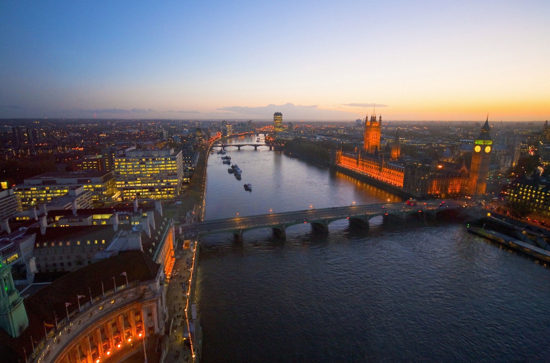 Aerial view of the River Thames, Houses of Parliament and Westminster Bridge at dusk